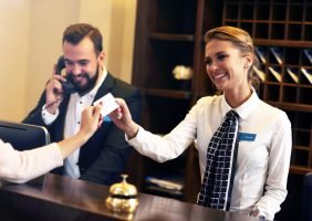 smiling hotel employee leaving positive first impression on guests